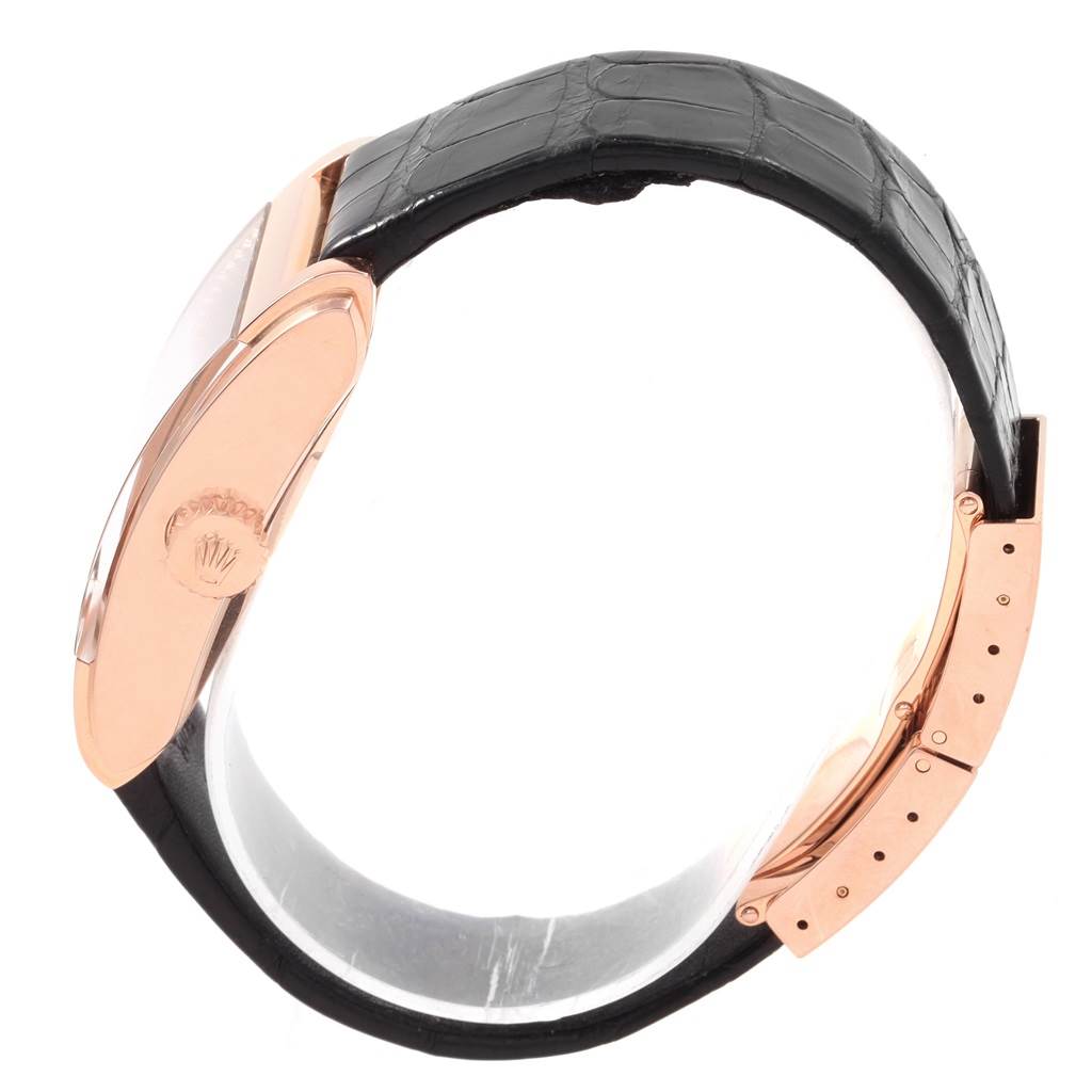 This image shows a Rolex Cellini 5442/5 Men's Rose Gold Black Dial 5442/5 Men's Rose Gold Black Dial watch from the side, highlighting the crown, case, and black leather strap.