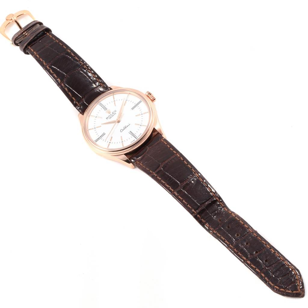 The Rolex Cellini 50505 Men's Rose Gold White Dial 50505 Men's Rose Gold White Dial watch is shown from a top view, displaying its face, case, crown, and leather strap.