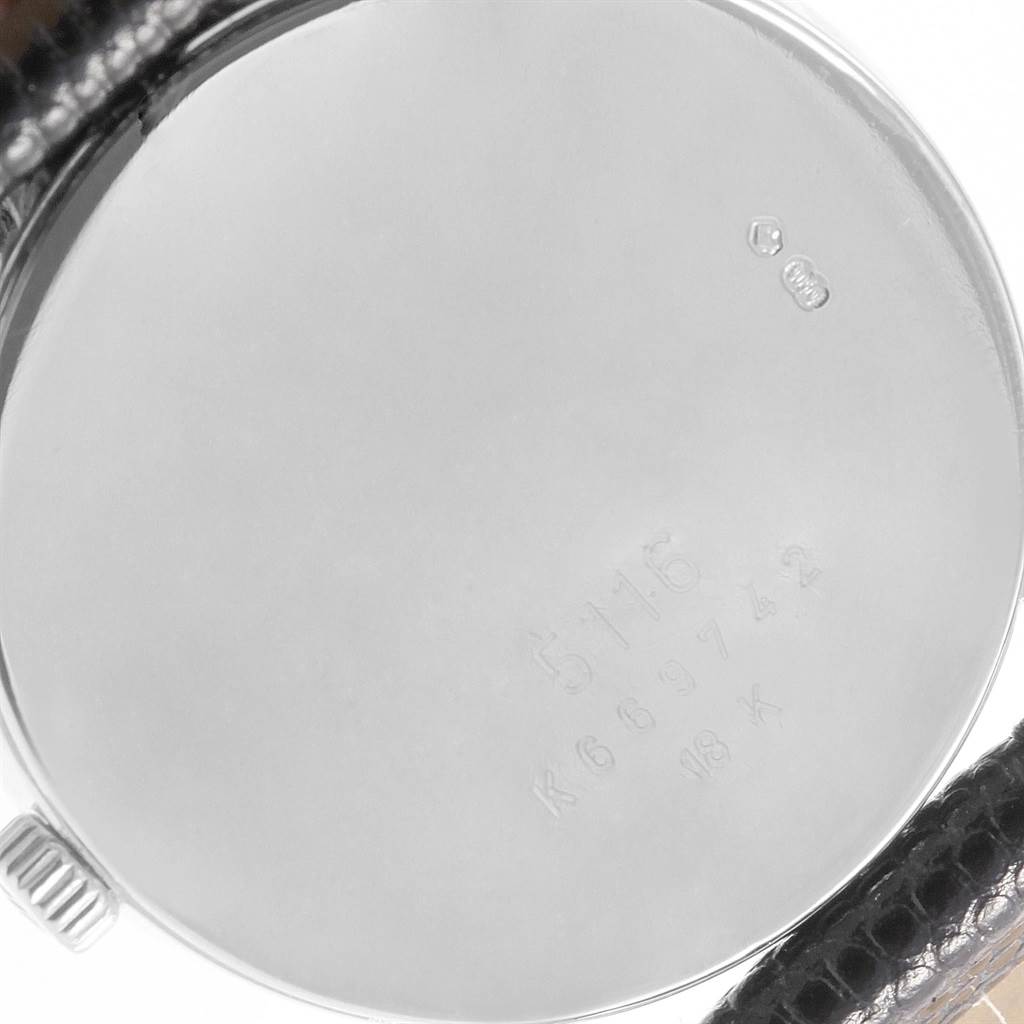 The image shows the back case and part of the leather strap of a Rolex Cellini 5116 Men's White Gold Silver Dial 5116 Men's White Gold Silver Dial watch.