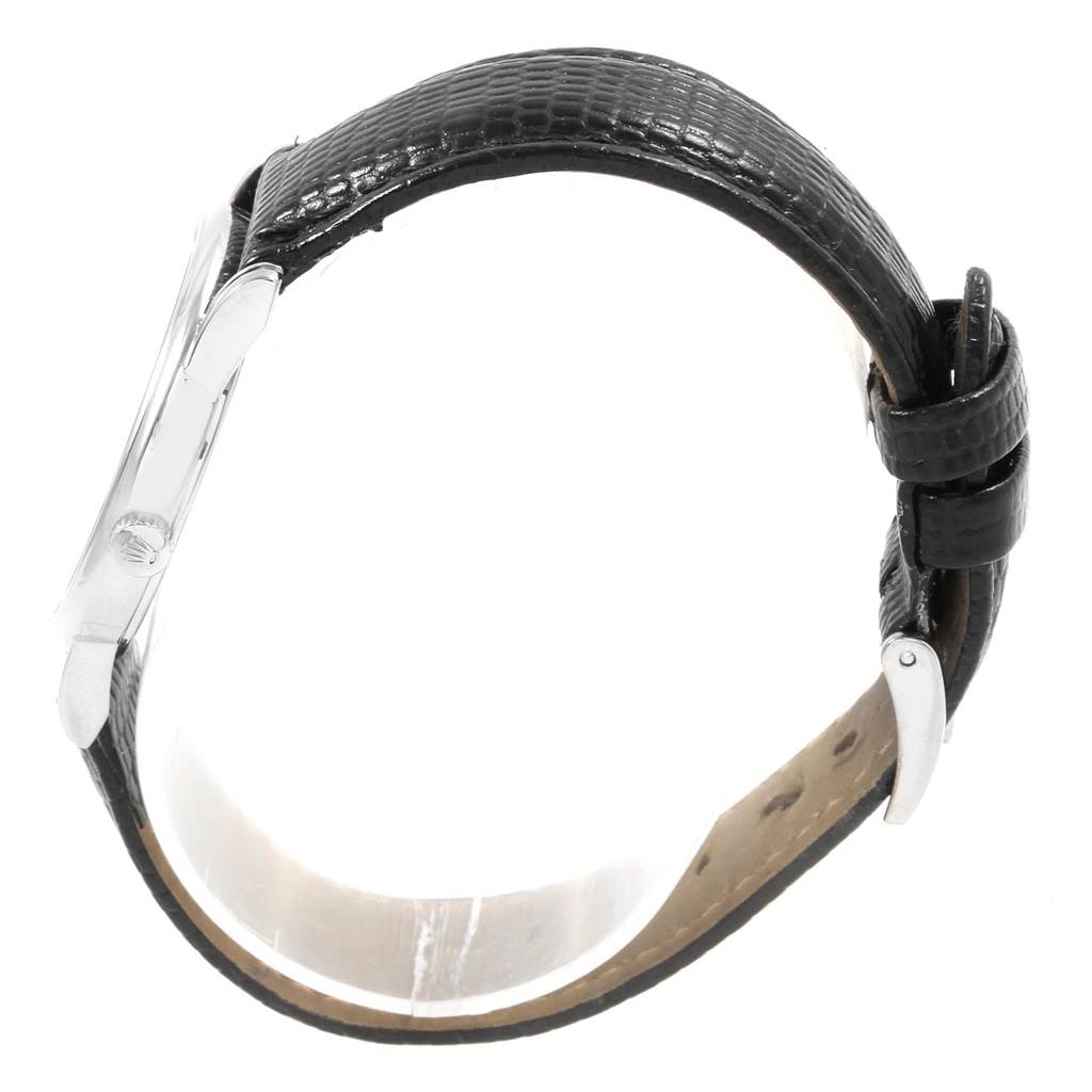 This image shows a side view of a Rolex Cellini 5116 Men's White Gold Silver Dial 5116 Men's White Gold Silver Dial watch, highlighting its black leather strap and crown.