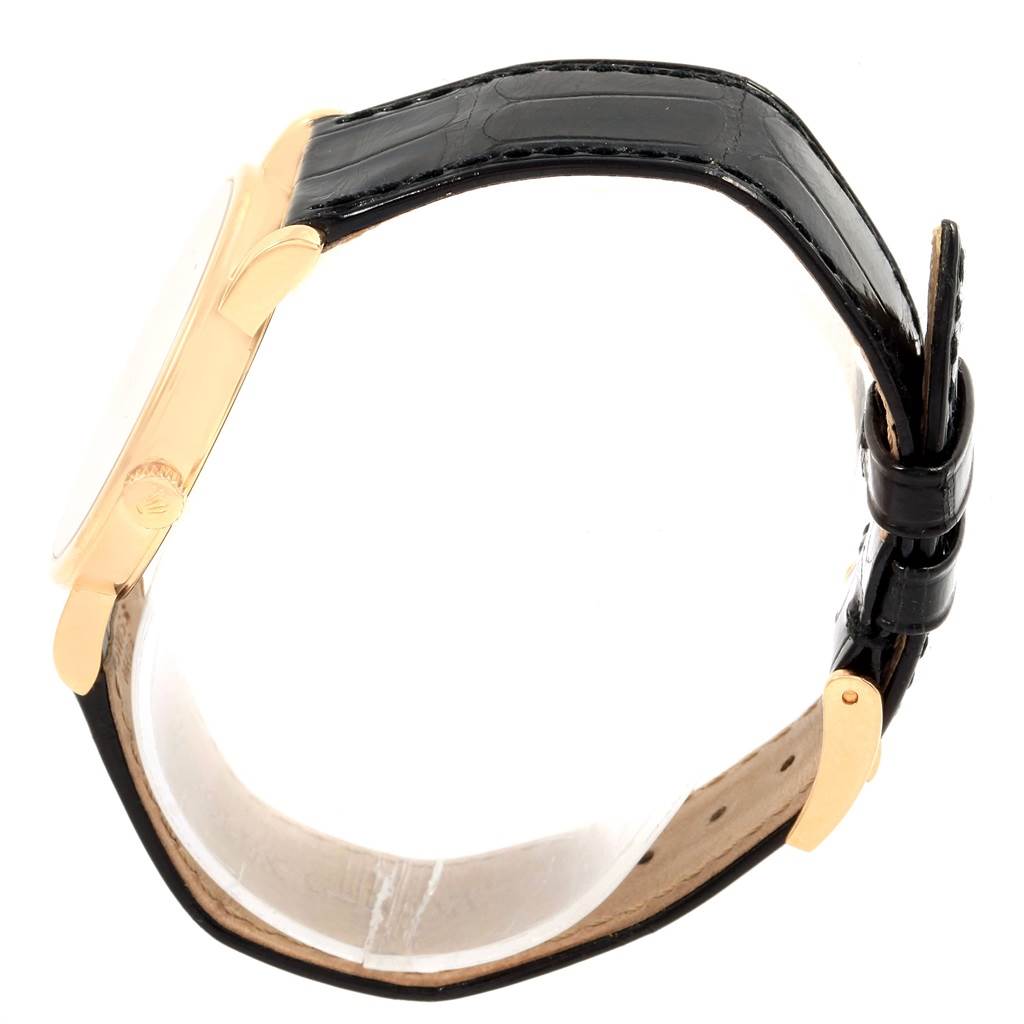 The image shows a side view of the Rolex Cellini 5115 Men's Yellow Gold Beige Dial 5115 Men's Yellow Gold Beige Dial watch, highlighting the gold case, crown, and black leather strap.