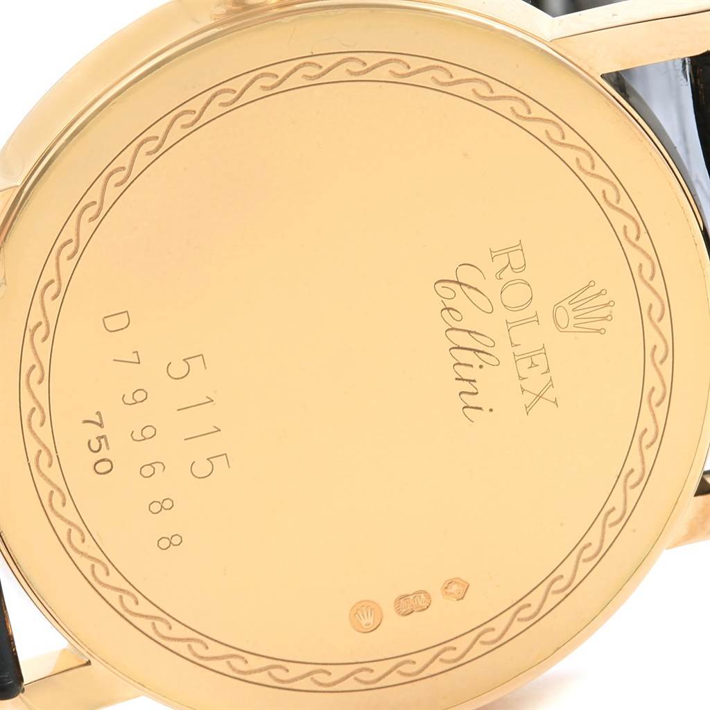 The image shows a close-up of the back case of a Rolex Cellini 5115 Men's Yellow Gold Beige Dial 5115 Men's Yellow Gold Beige Dial watch, displaying model and serial numbers.