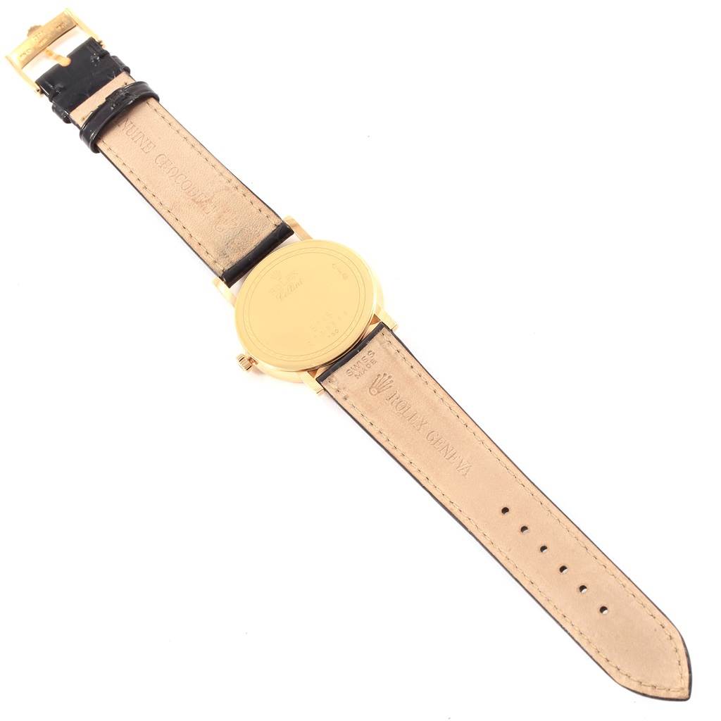 This is the back view of a Rolex Cellini 5115 Men's Yellow Gold Beige Dial 5115 Men's Yellow Gold Beige Dial watch, showing its case back and leather straps.