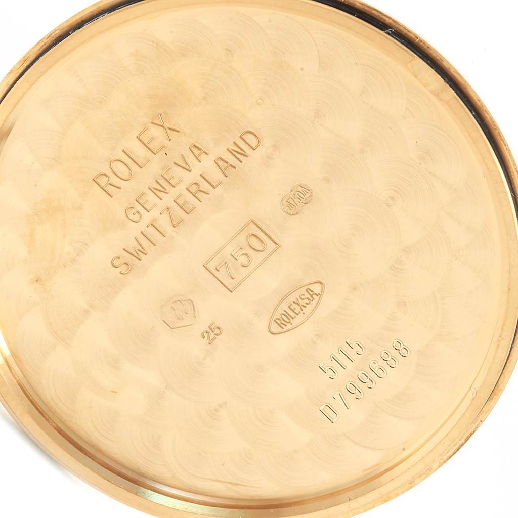 The image shows the inside of the case back of a Rolex Cellini 5115 Men's Yellow Gold Beige Dial 5115 Men's Yellow Gold Beige Dial watch with various engravings.