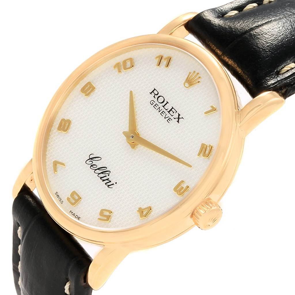 The Rolex Cellini 5115 Yellow Gold Mother of Pearl Dial 5115 Yellow Gold Mother of Pearl Dial watch is shown from an angled top view, highlighting the dial, crown, and leather strap.