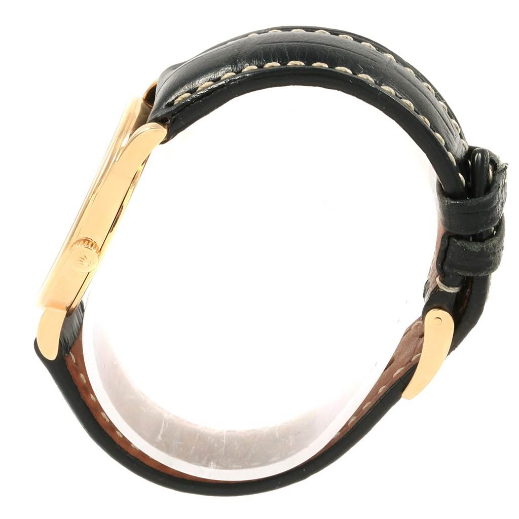 The image shows a side view of the Rolex Cellini 5115 Yellow Gold Mother of Pearl Dial 5115 Yellow Gold Mother of Pearl Dial watch, highlighting the black strap and side of the golden case.