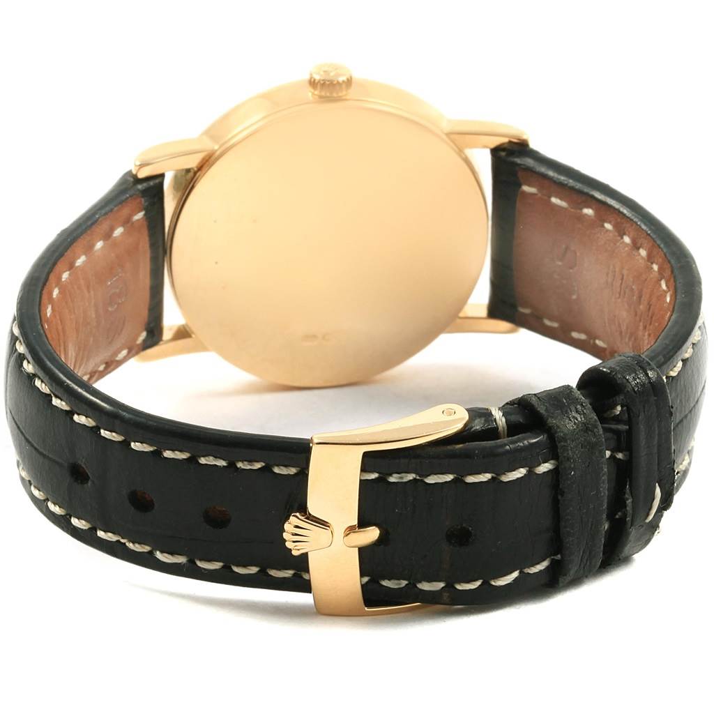 This image shows the back view of a Rolex Cellini 5115 Yellow Gold Mother of Pearl Dial 5115 Yellow Gold Mother of Pearl Dial watch, highlighting its leather strap and buckle.