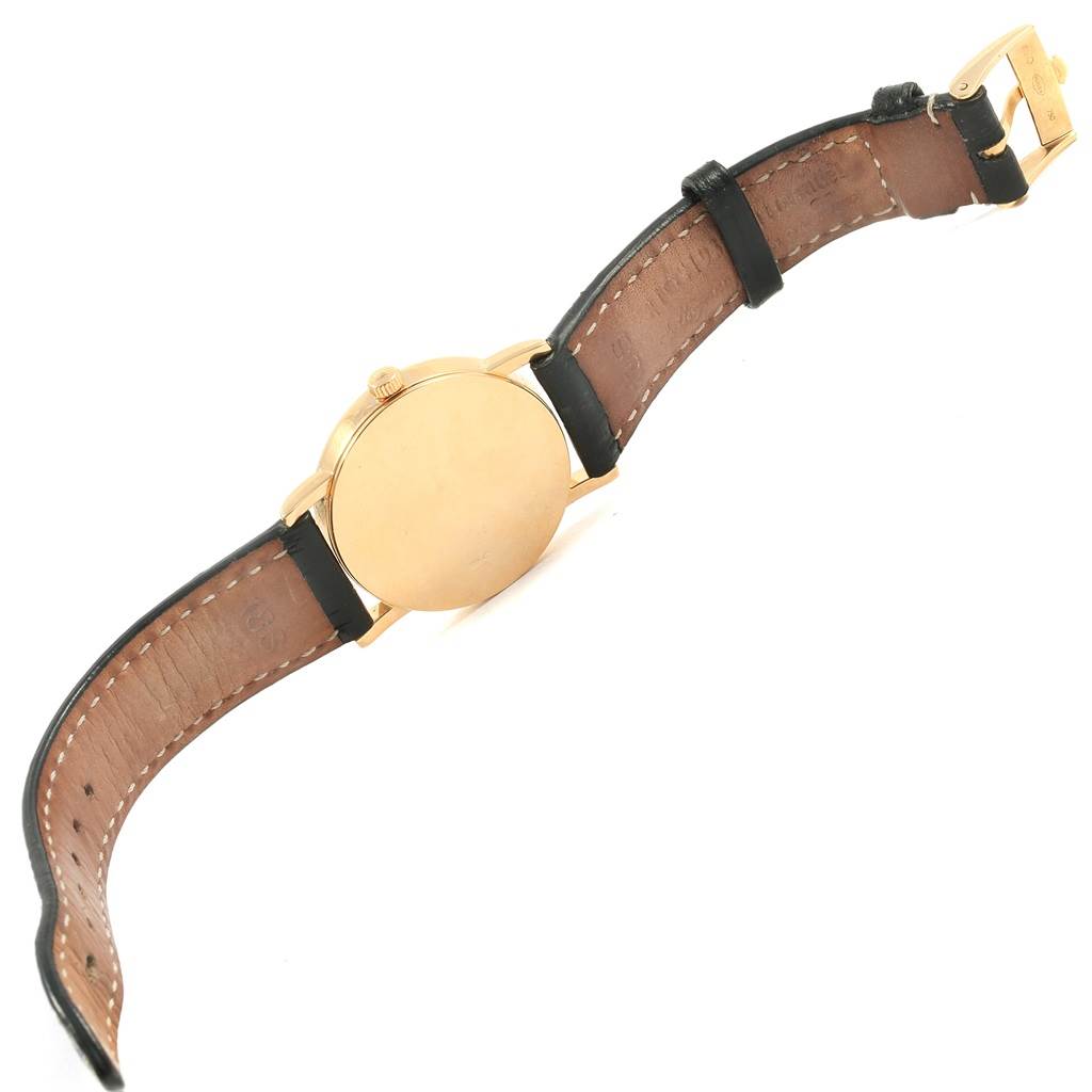 The image shows the back view of a Rolex Cellini 5115 Yellow Gold Mother of Pearl Dial 5115 Yellow Gold Mother of Pearl Dial watch displaying its case, crown, and leather strap.