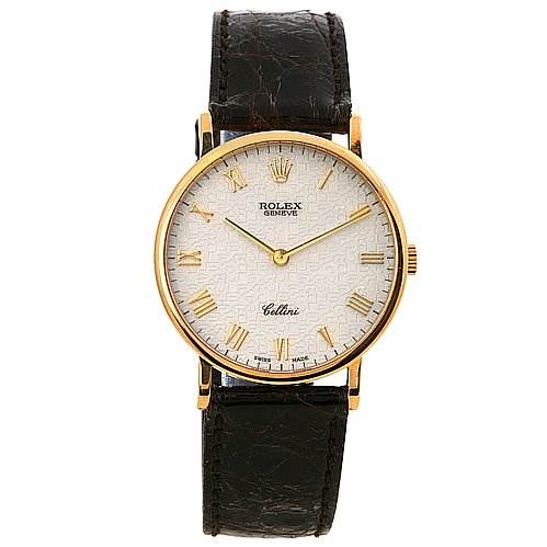 The image shows a Rolex Cellini 5112 Yellow Gold Beige Dial 5112 Yellow Gold Beige Dial watch from a front angle, highlighting its gold casing, white dial, Roman numerals, and black leather strap.