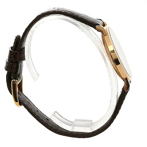 This side view of the Rolex Cellini 5112 Yellow Gold Beige Dial 5112 Yellow Gold Beige Dial watch shows the leather strap and gold case.