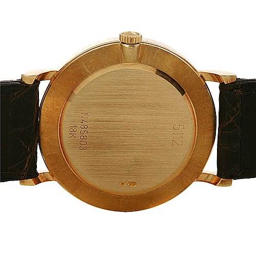 The image shows the back case of a Rolex Cellini 5112 Yellow Gold Beige Dial 5112 Yellow Gold Beige Dial watch, highlighting the engravings and leather straps.