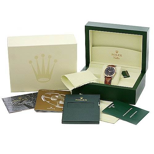 The image shows a Rolex Cellini 4233 Men's White Gold Black Dial 4233 Men's White Gold Black Dial watch at an angled view, along with its box, microfiber cloth, and accompanying documentation.