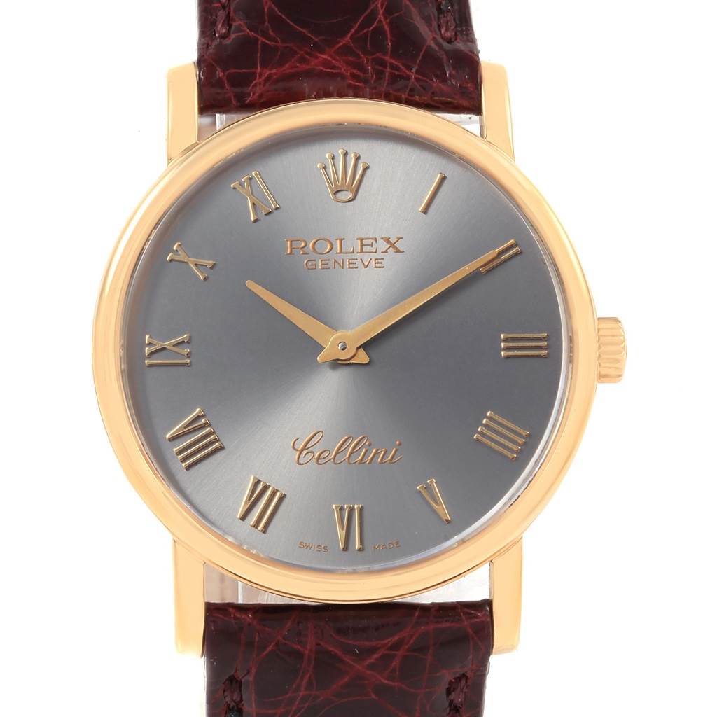 The image shows a front view of a Rolex Cellini 5115 Men
s Yellow Gold Grey Dial 5115 Men
s Yellow Gold Grey Dial watch, featuring a gold bezel, grey dial, and brown leather strap.