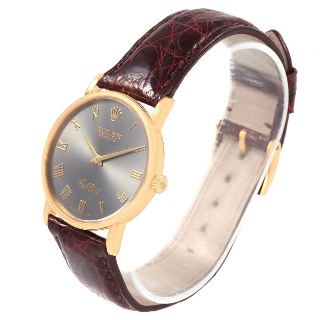 This Rolex Cellini 5115 Men
s Yellow Gold Grey Dial 5115 Men
s Yellow Gold Grey Dial watch is shown at a slight angle, displaying its dial, case, and leather strap.