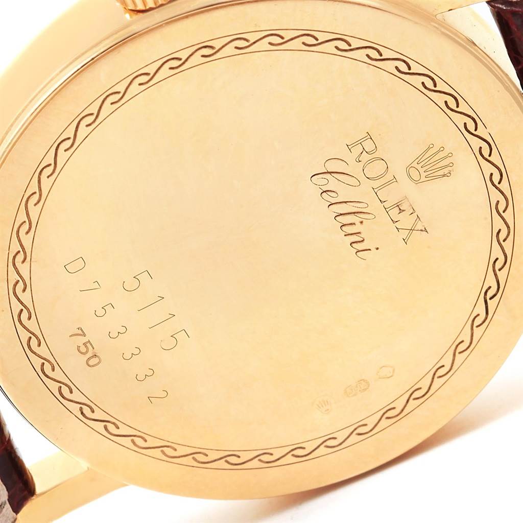 This image shows the back case of the Rolex Cellini 5115 Men
s Yellow Gold Grey Dial 5115 Men
s Yellow Gold Grey Dial watch, featuring its engravings and model number.