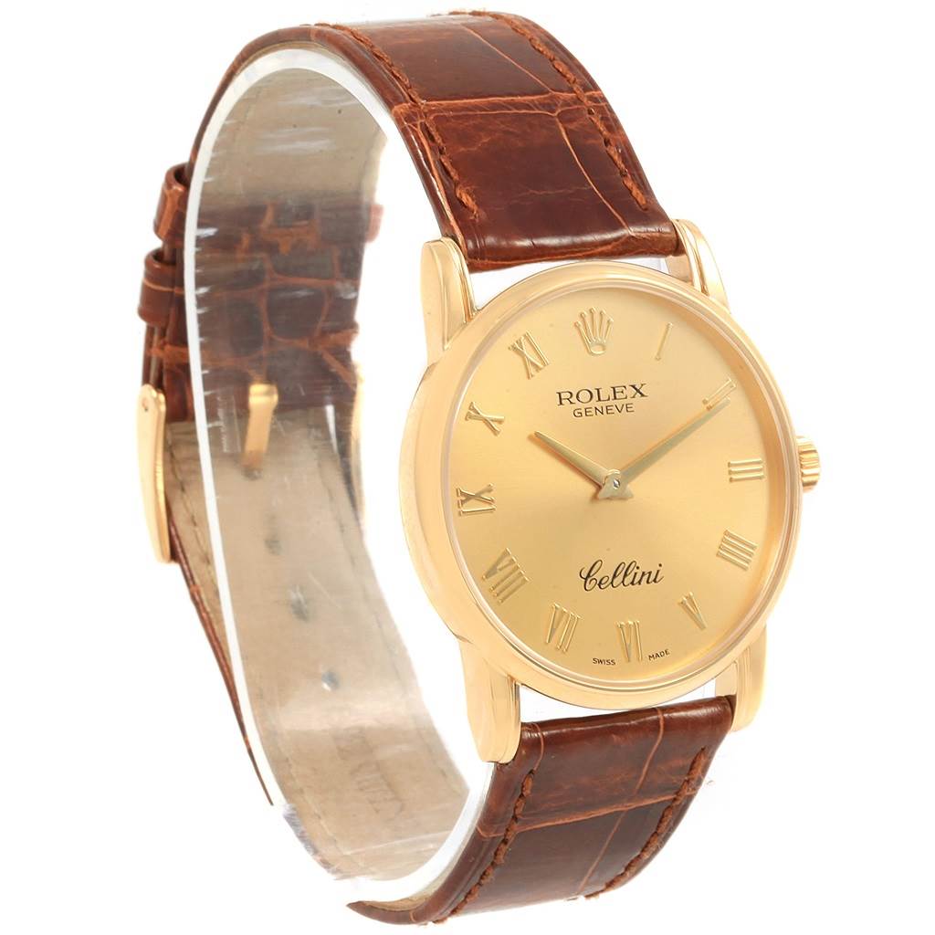 This image shows a Rolex Cellini 5116 Men's Yellow Gold Champagne Dial 5116 Men's Yellow Gold Champagne Dial watch from an angled front view, highlighting its gold dial and brown leather strap.