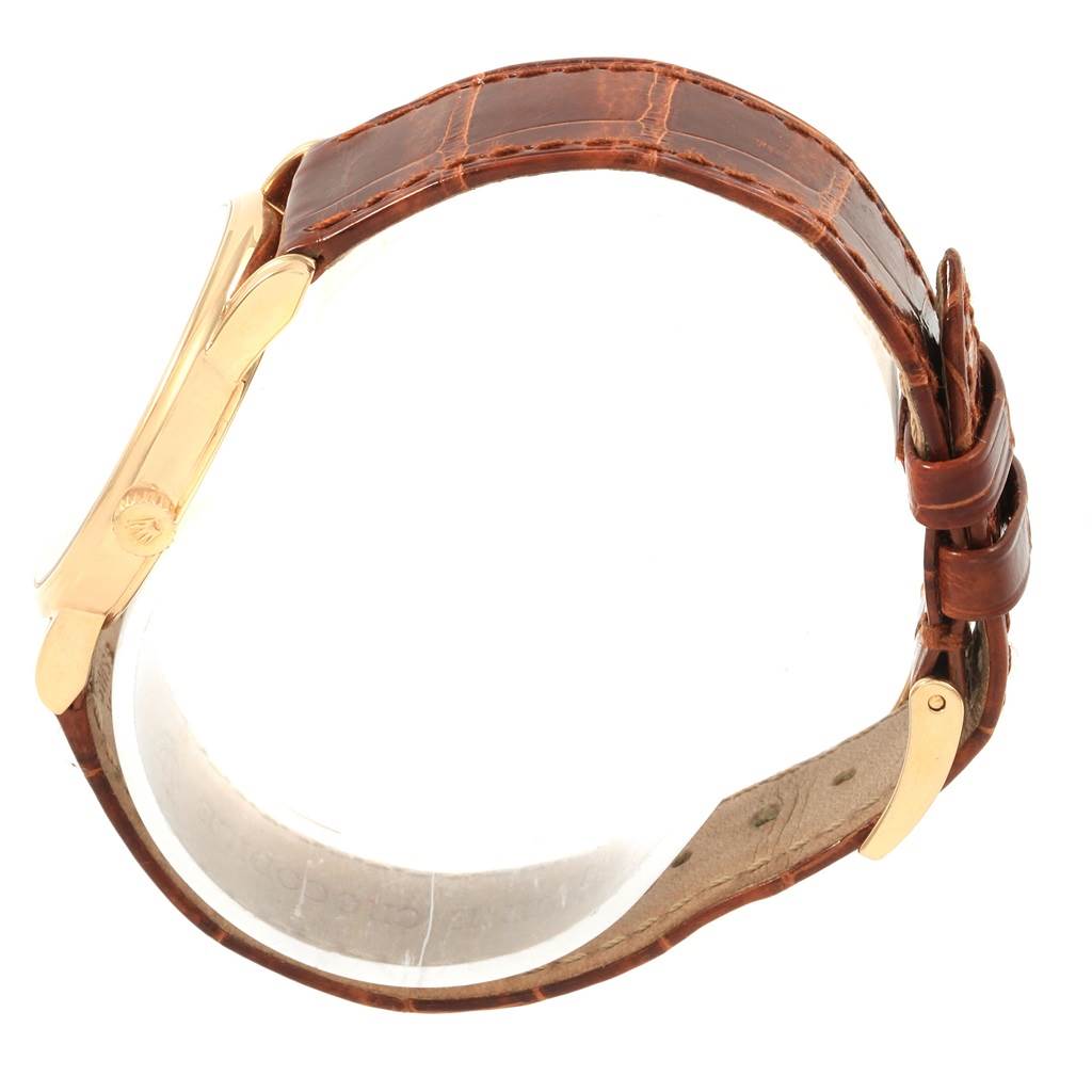 The image shows the side view of a Rolex Cellini 5116 Men's Yellow Gold Champagne Dial 5116 Men's Yellow Gold Champagne Dial watch, focusing on its brown leather strap and gold clasp.