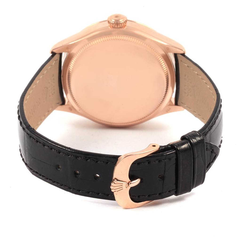 This image shows the back case and clasp of a Rolex Cellini 50515 Men's Rose Gold Silver Dial 50515 Men's Rose Gold Silver Dial watch, highlighting its detailing and black leather strap.