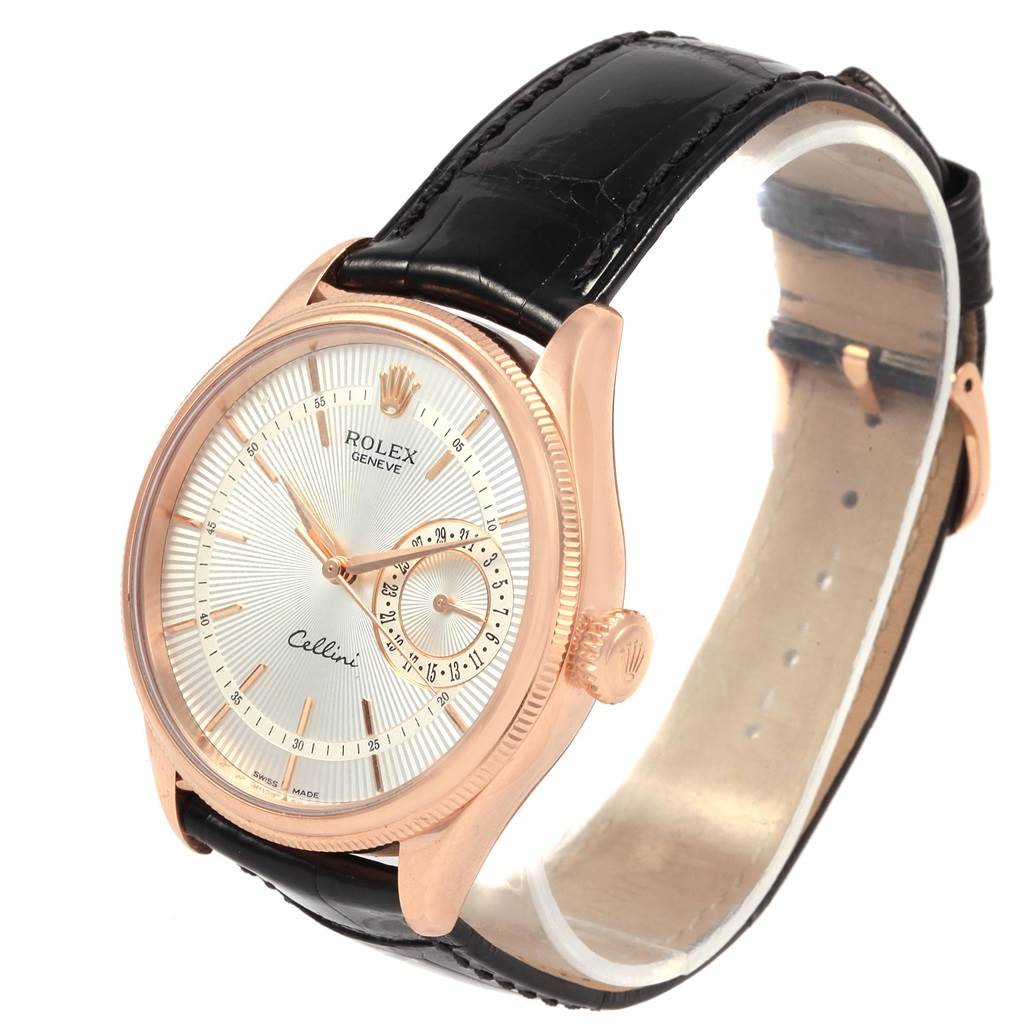 The Rolex Cellini 50515 Men's Rose Gold Silver Dial 50515 Men's Rose Gold Silver Dial watch is shown at an angled view, highlighting its dial, bezel, crown, and leather strap.