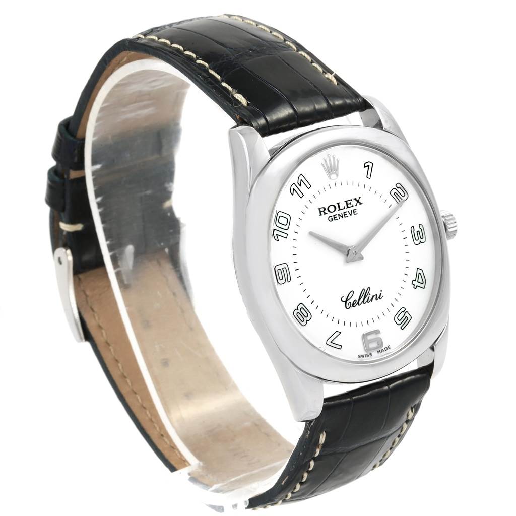 This image shows a Rolex Cellini 4233 Men
s White Gold White Dial 4233 Men
s White Gold White Dial watch from a side angle, featuring its white dial, black leather strap, and stainless steel case.
