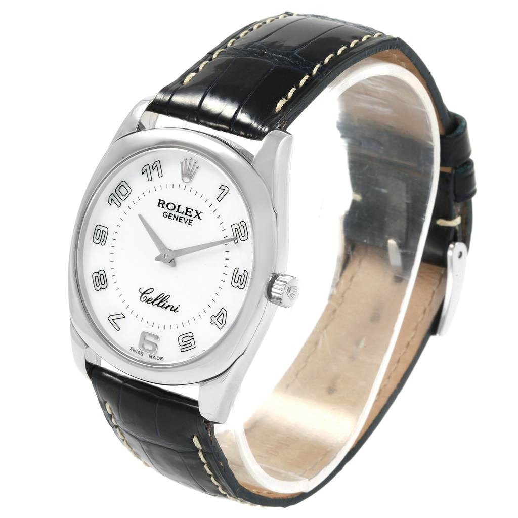 The image shows a Rolex Cellini 4233 Men
s White Gold White Dial 4233 Men
s White Gold White Dial watch at an angled view, displaying the face, crown, and black leather strap.