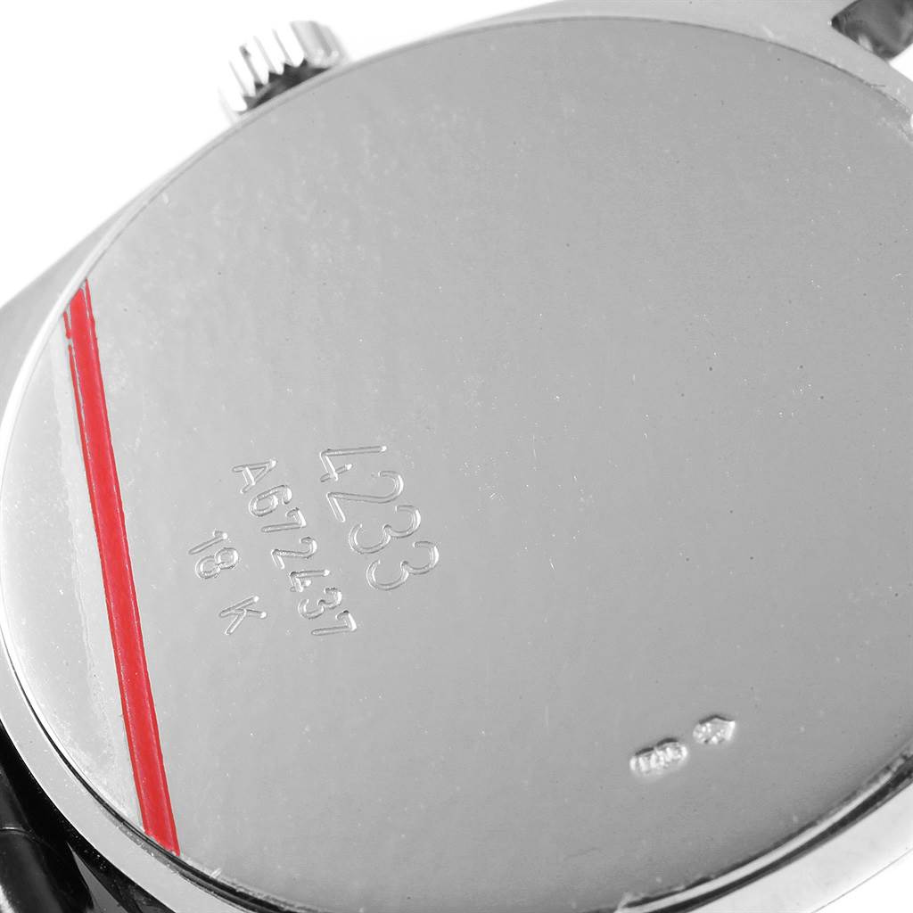 The image shows the back case of the Rolex Cellini 4233 Men
s White Gold White Dial 4233 Men
s White Gold White Dial model watch, including the serial number and 18K gold stamp.