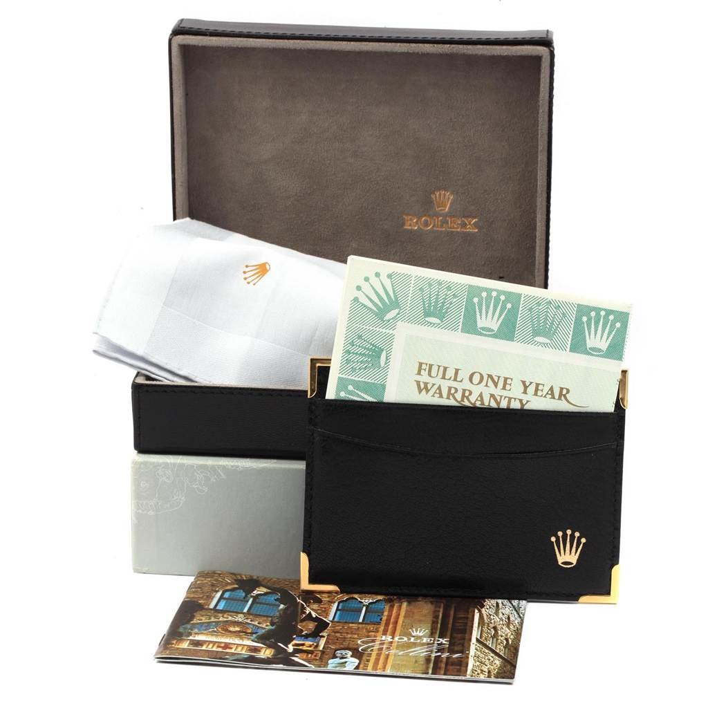 This image shows a Rolex Cellini 4233 Men
s White Gold White Dial 4233 Men
s White Gold White Dial watch box with warranty cards, cleaning cloth, and a booklet at a front angle.
