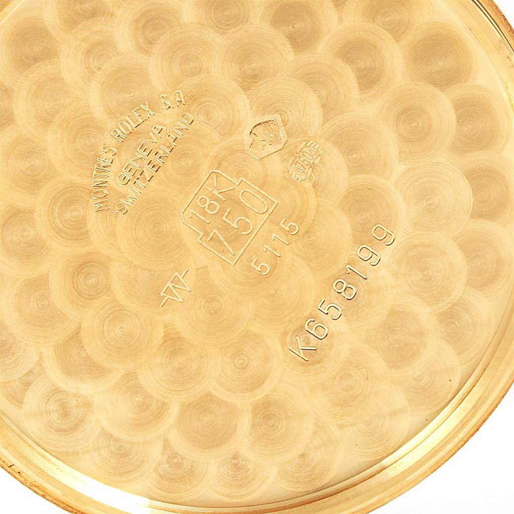 This image shows the inner case back of a Rolex Cellini 5115 Yellow Gold Mother of Pearl Dial 5115 Yellow Gold Mother of Pearl Dial watch with engravings and hallmarks visible.