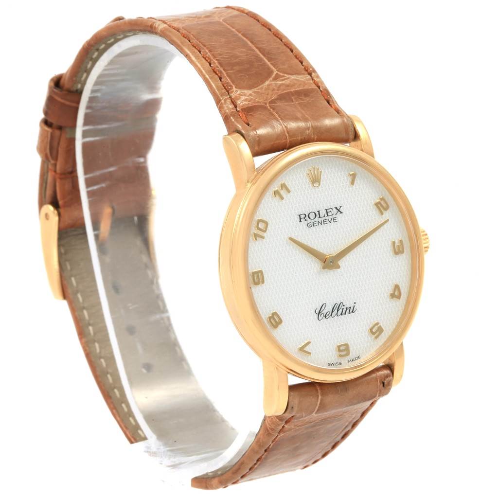 The Rolex Cellini 5115 Yellow Gold Mother of Pearl Dial 5115 Yellow Gold Mother of Pearl Dial watch is shown at a slight angle, highlighting its gold case, white dial, and brown leather strap.