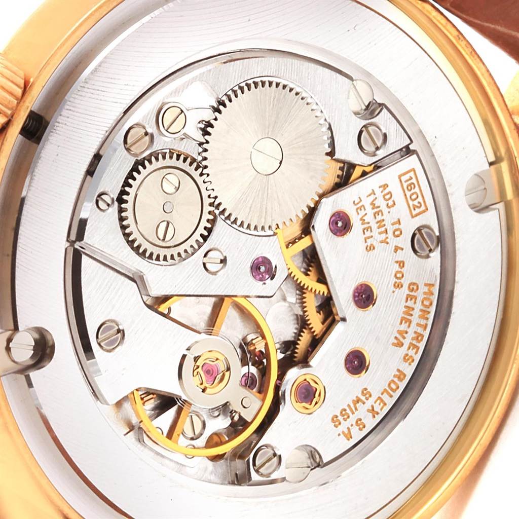 The image shows the intricate internal mechanism of the Rolex Cellini 5115 Yellow Gold Mother of Pearl Dial 5115 Yellow Gold Mother of Pearl Dial watch at a close-up angle.