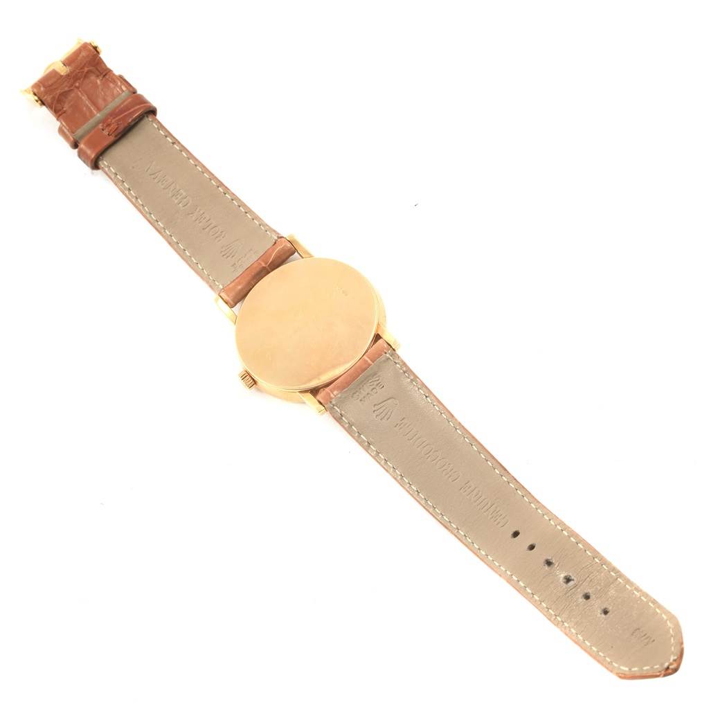 The Rolex Cellini 5115 Yellow Gold Mother of Pearl Dial 5115 Yellow Gold Mother of Pearl Dial watch is shown from the back, displaying the caseback and leather strap.