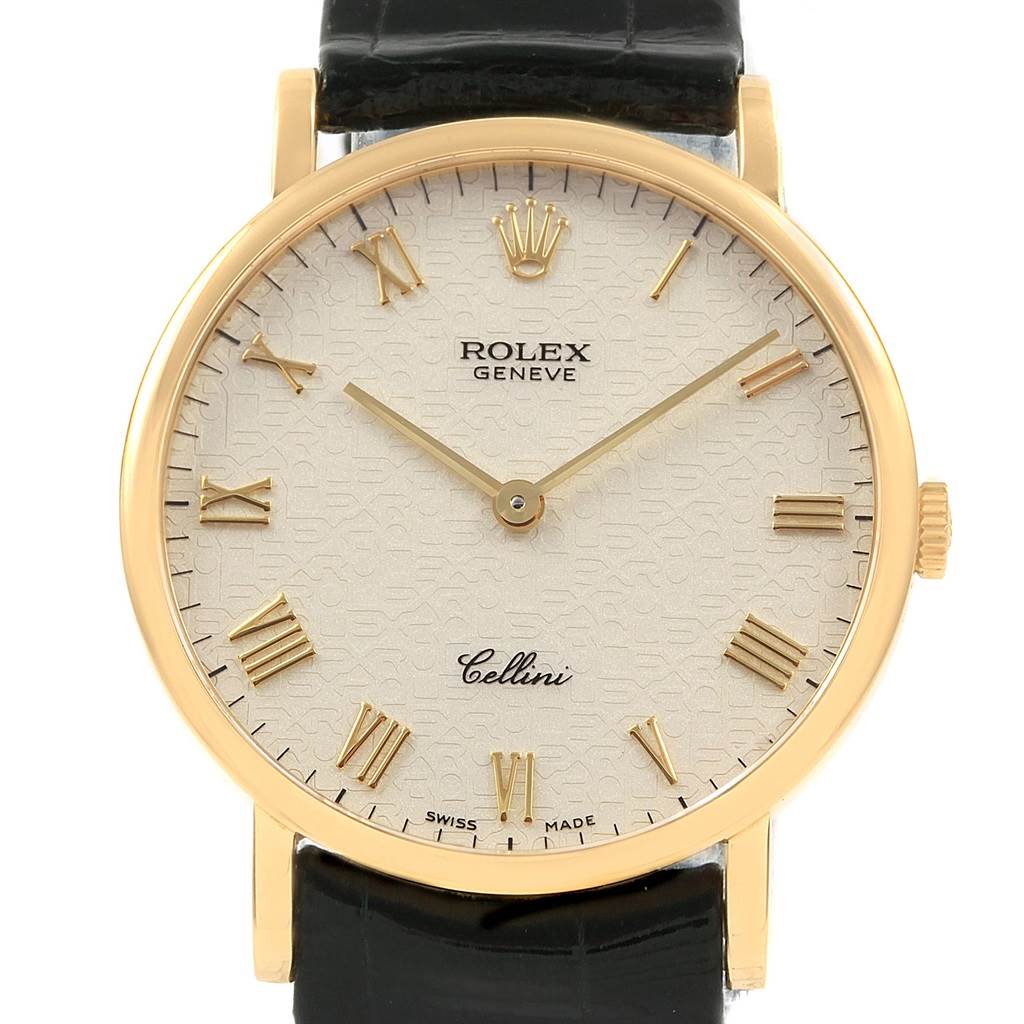 The image shows a front view of the Rolex Cellini 5112 Men's Yellow Gold Beige Dial 5112 Men's Yellow Gold Beige Dial watch face, featuring gold Roman numerals, the Rolex logo, and a black leather strap.