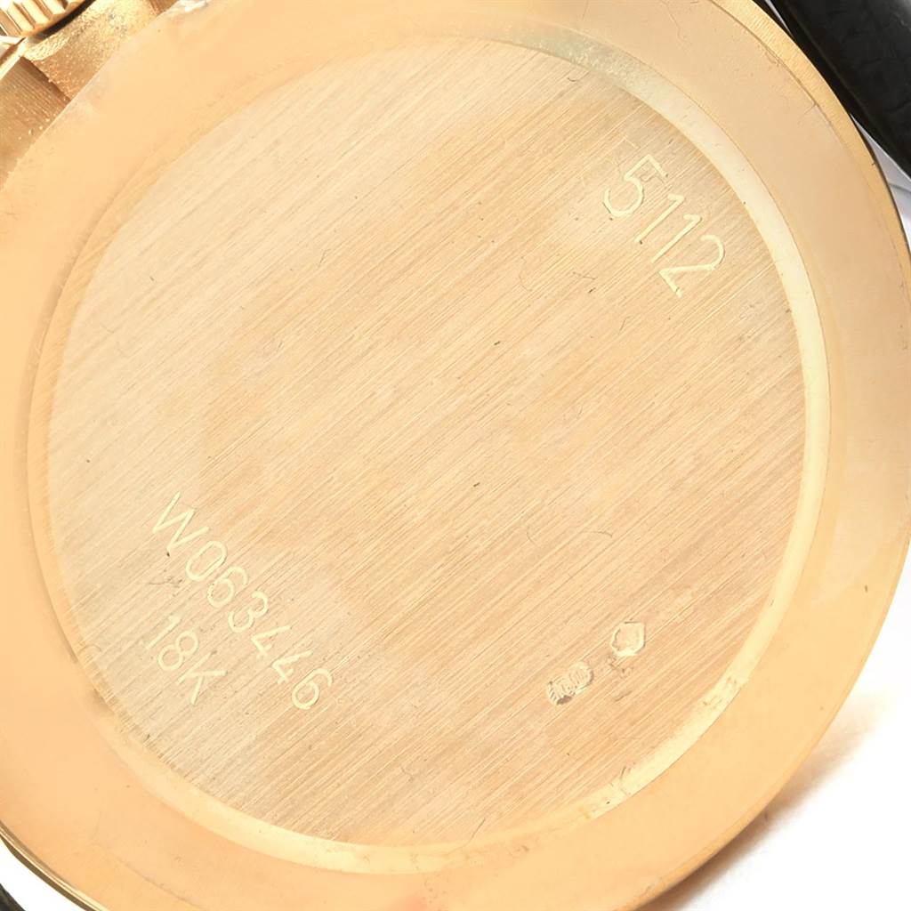 This image shows the back case of a Rolex Cellini 5112 Men's Yellow Gold Beige Dial 5112 Men's Yellow Gold Beige Dial watch, focusing on the engravings and material details.