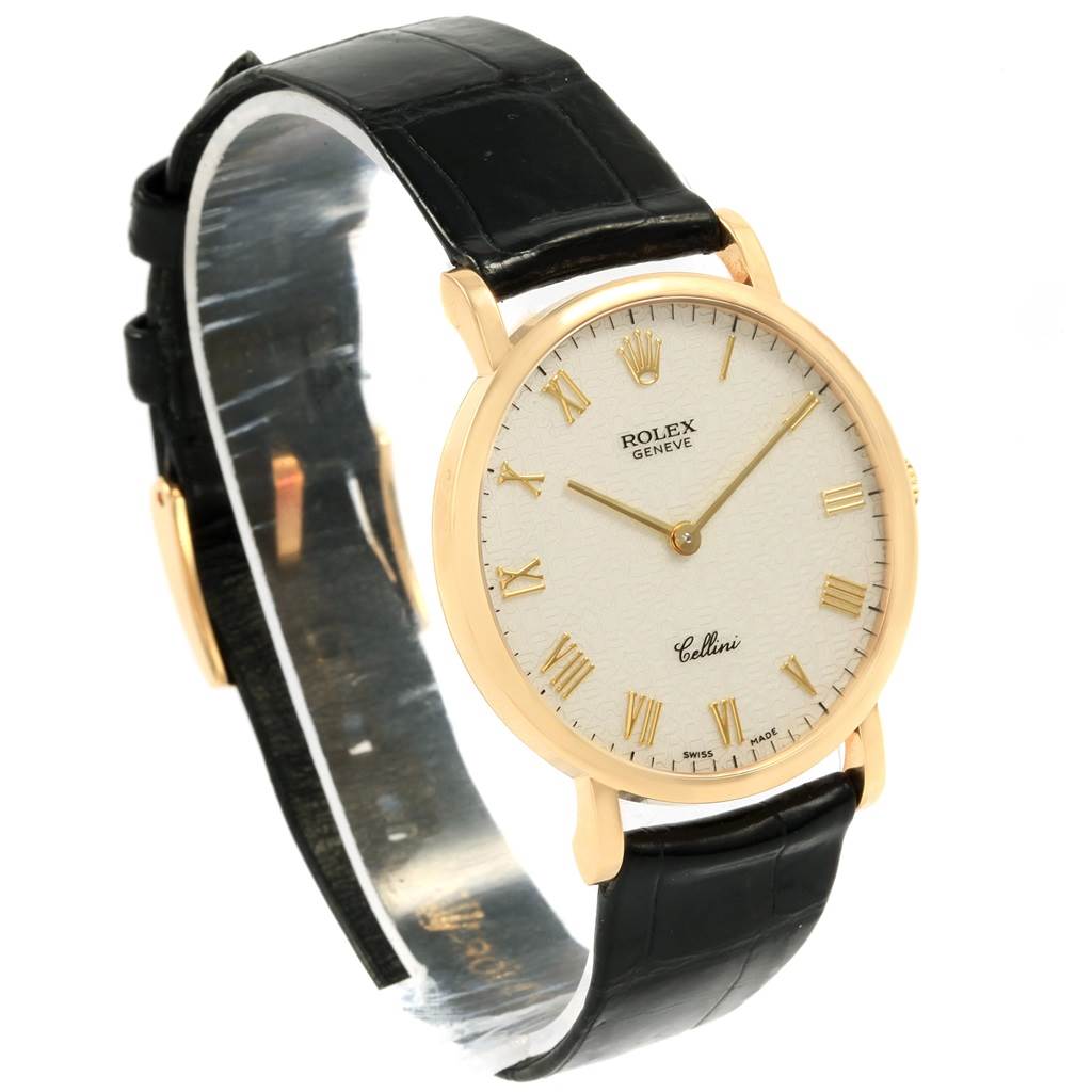 This image shows a Rolex Cellini 5112 Men's Yellow Gold Beige Dial 5112 Men's Yellow Gold Beige Dial watch at a slight angle from the front, highlighting the face, hour markers, and its black strap.