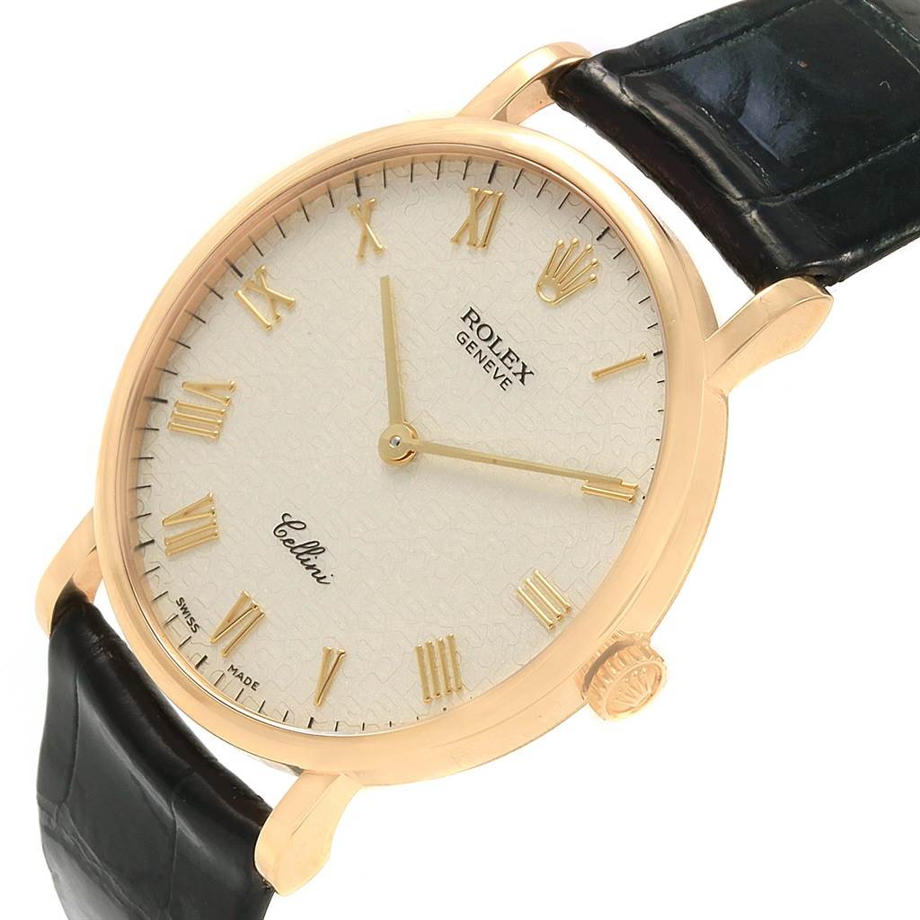 The image shows a Rolex Cellini 5112 Men's Yellow Gold Beige Dial 5112 Men's Yellow Gold Beige Dial watch at an angle emphasizing the face, crown, and part of the leather strap.
