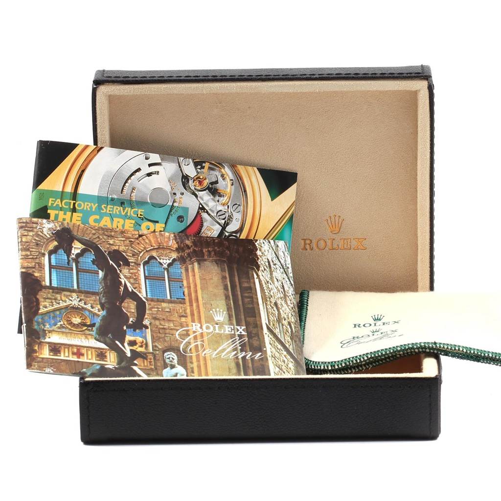 The image shows a Rolex Cellini 5116 Men's Yellow Gold Beige Dial 5116 Men's Yellow Gold Beige Dial watch box and accessories, including brochures and a pouch, viewed from the front.