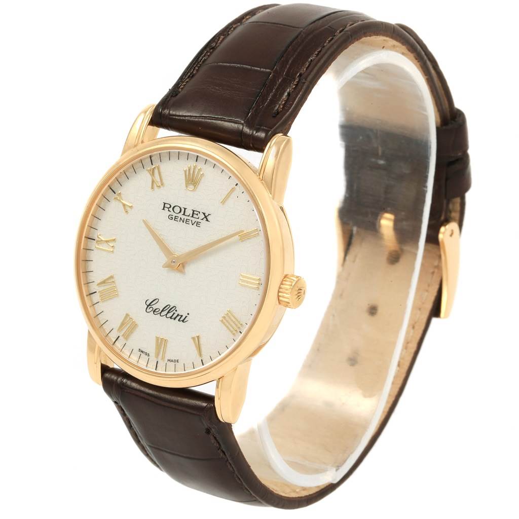 This image shows a Rolex Cellini 5116 Men's Yellow Gold Beige Dial 5116 Men's Yellow Gold Beige Dial watch at a slight angle, highlighting the face, crown, and brown leather strap.