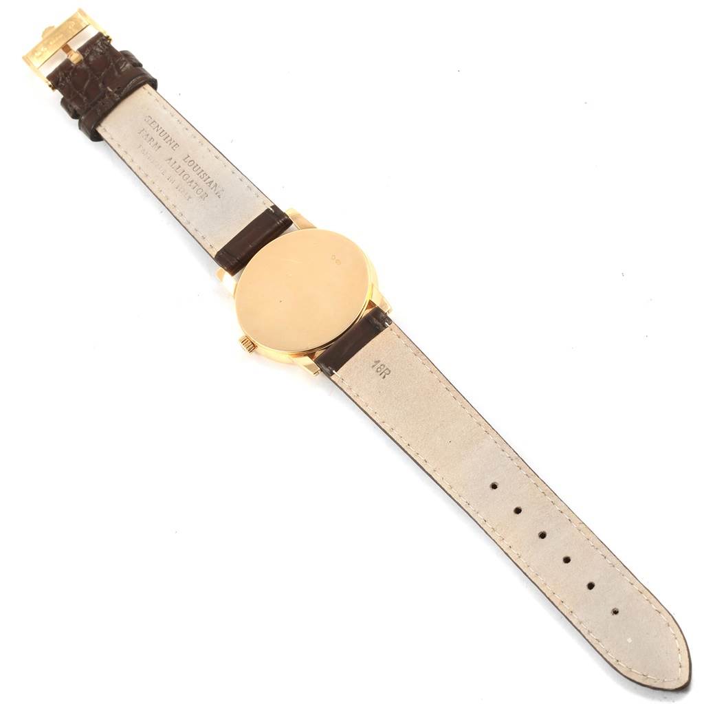 This image shows the back view of a Rolex Cellini 5116 Men's Yellow Gold Beige Dial 5116 Men's Yellow Gold Beige Dial watch, highlighting its brown leather strap and gold case.