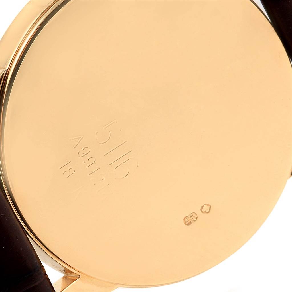 This image shows the back case of the Rolex Cellini 5116 Men's Yellow Gold Beige Dial 5116 Men's Yellow Gold Beige Dial watch, highlighting the gold surface and model engravings.