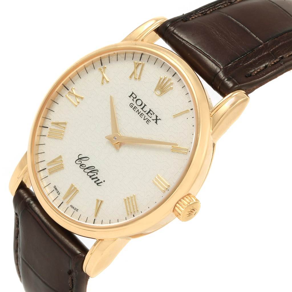The image displays a close-up angle of a Rolex Cellini 5116 Men's Yellow Gold Beige Dial 5116 Men's Yellow Gold Beige Dial watch, showing its face, gold case, and brown leather strap.