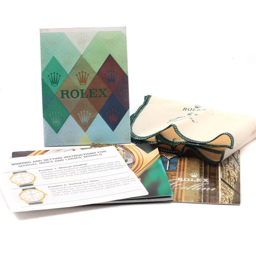 The image shows Rolex Cellini 5115 Yellow Gold Mother of Pearl Dial 5115 Yellow Gold Mother of Pearl Dial booklets, a polishing cloth, and instruction manuals.