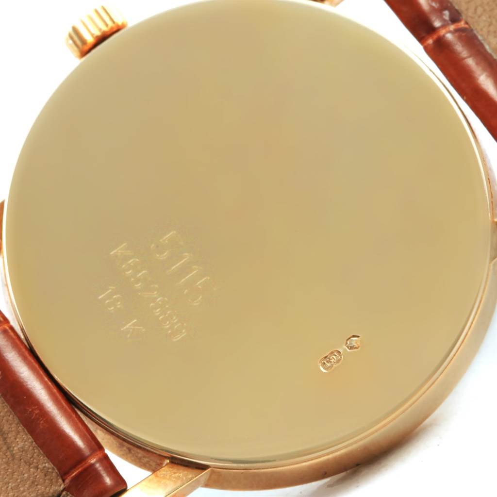 The image shows the gold case back and brown leather straps of the Rolex Cellini 5115 Yellow Gold Mother of Pearl Dial 5115 Yellow Gold Mother of Pearl Dial model from a bottom angle.