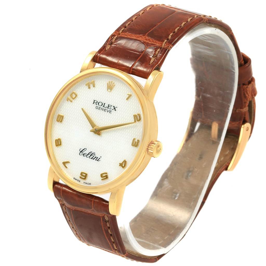 This image shows a Rolex Cellini 5115 Yellow Gold Mother of Pearl Dial 5115 Yellow Gold Mother of Pearl Dial watch from a front angle, highlighting its face, golden case, crown, and brown leather strap.