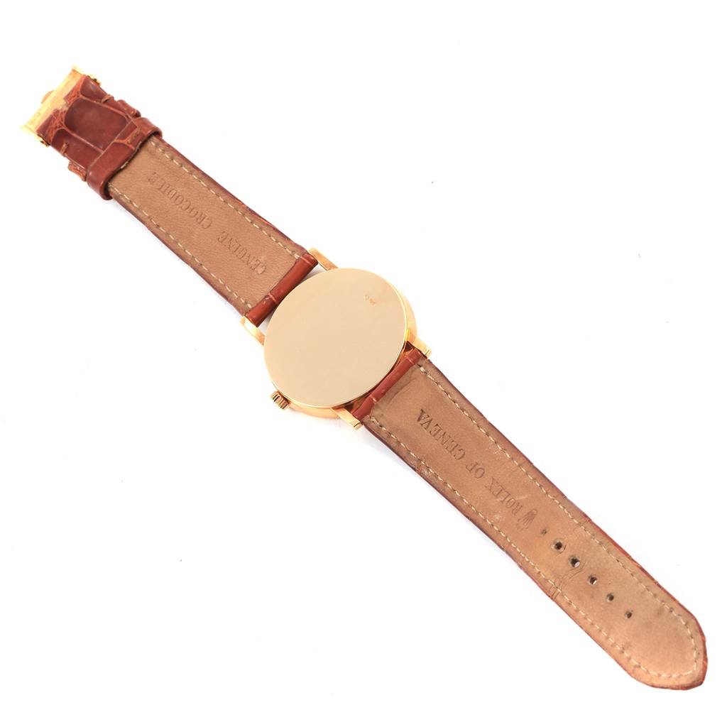 The image shows the back and strap of a Rolex Cellini 5115 Yellow Gold Mother of Pearl Dial 5115 Yellow Gold Mother of Pearl Dial watch, highlighting its leather band and case back.