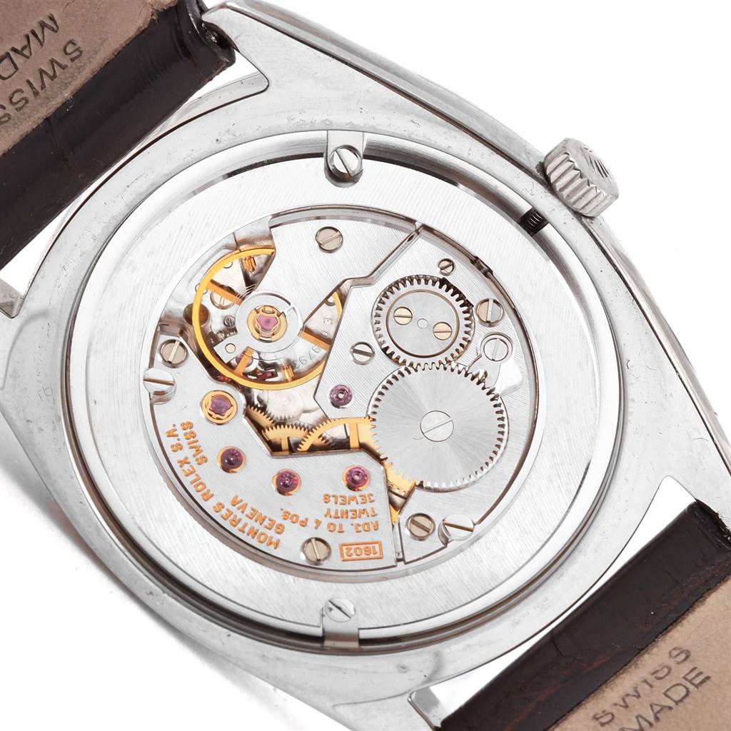 The image shows the back view of a Rolex Cellini 4233 Men's White Gold White Dial 4233 Men's White Gold White Dial watch, highlighting its exposed mechanical movement and inner gears.