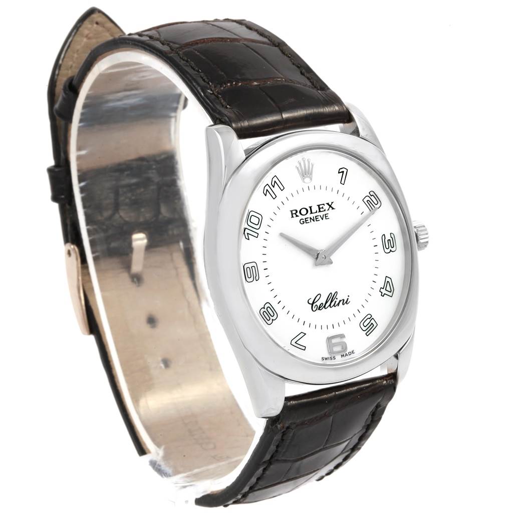 The image shows a Rolex Cellini 4233 Men's White Gold White Dial 4233 Men's White Gold White Dial watch from an angled view, featuring its dial, bezel, case, crown, and leather strap.