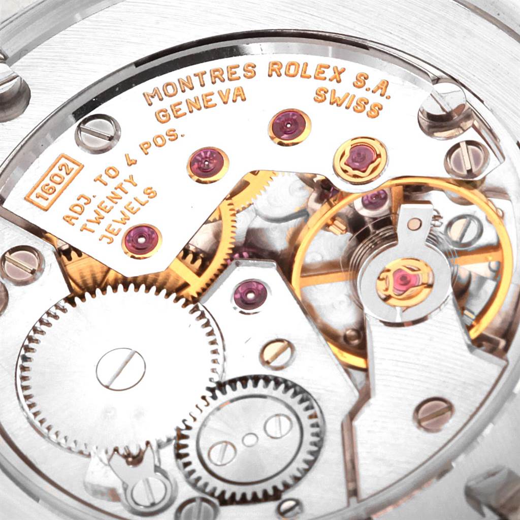 This image shows a close-up of the mechanical movement of the Rolex Cellini 4233 Men's White Gold Black Dial 4233 Men's White Gold Black Dial watch, highlighting its intricate gears and jewel components.