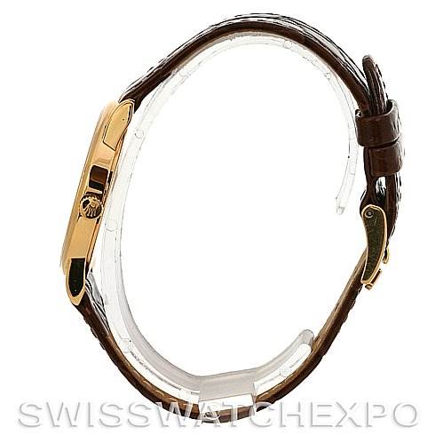 The image shows a side view of the Rolex Cellini 5116 Yellow Gold Silver Dial 5116 Yellow Gold Silver Dial watch, highlighting its case, crown, and brown leather strap.