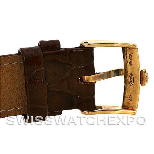 The image shows a close-up of the clasp and leather strap of a Rolex Cellini 5116 Yellow Gold Silver Dial 5116 Yellow Gold Silver Dial watch.