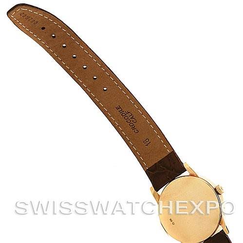 This image shows the back of a Rolex Cellini 5116 Yellow Gold Silver Dial 5116 Yellow Gold Silver Dial watch, focusing on the leather strap, stitching, and the case back.